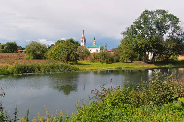 istock Summer river landscape with churches in the distance in Suzdal. 1285486529