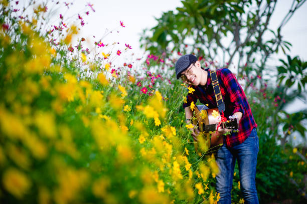 istock Guitarists are playing guitars happily. Music Concepts 1285486660