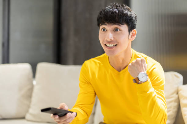 istock man watching tv at home 1285487305