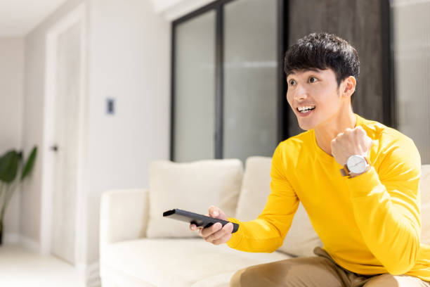 man watching tv at home