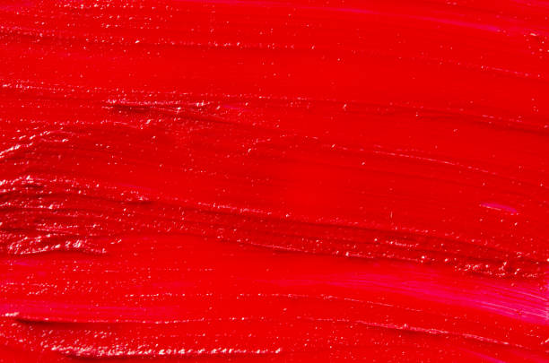 istock Lipstick smear sample texture.  Abstract red paint brush and strokes. Image 1285488057