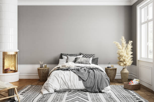 istock White gray bedroom interior with fireplace carpet, dry plants and decor. 3d render illustration mock up. 1285488884