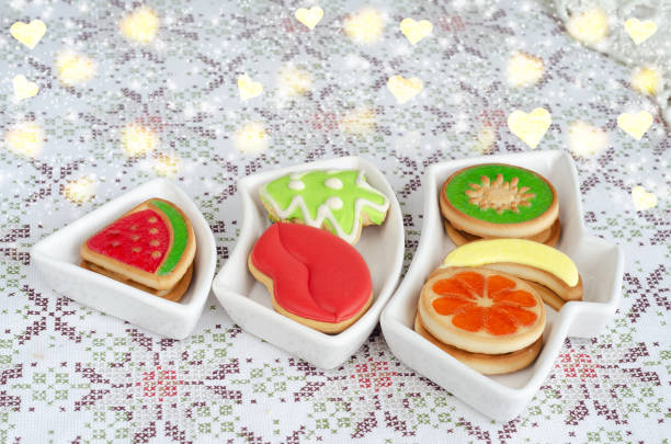 Shaped cookies on a plate in the shape of a Christmas tree. Heart-shaped bokeh