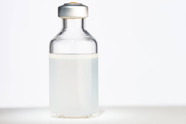 istock Glass vial containing vaccine dose 1285489008