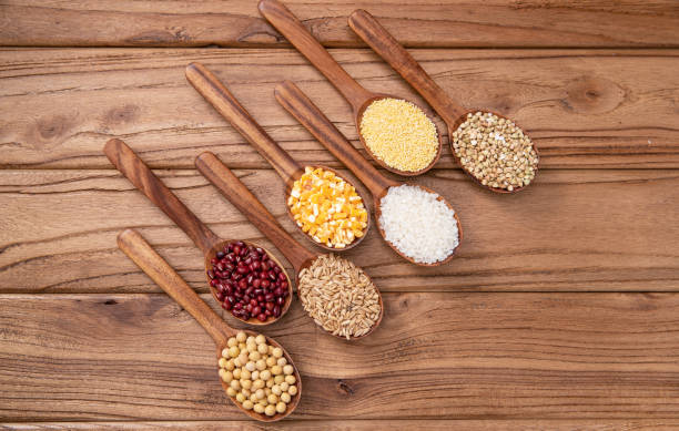 istock Wooden spoon is filled with grain 1285489217