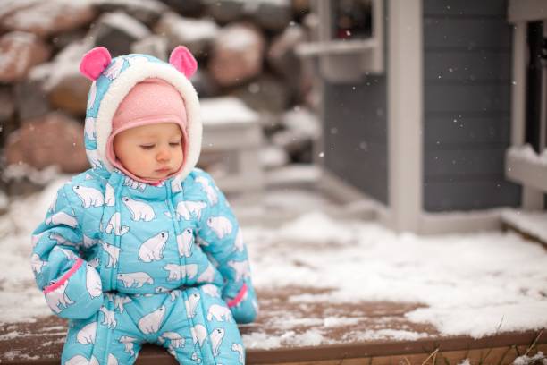 cute infant in the snow - snow gear imagens e fotografias de stock