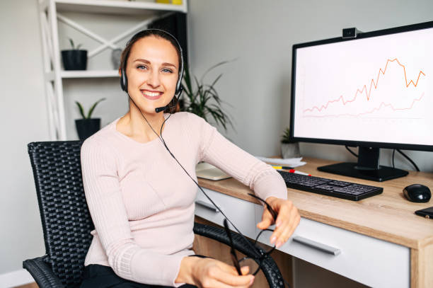 istock Woman in glasses works with PC and using headset 1285491068