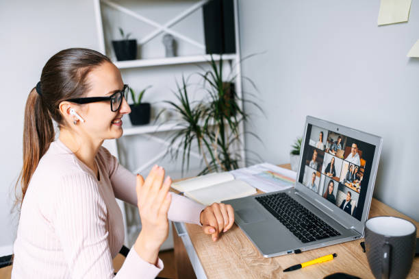 istock Woman using app for video call to several people 1285491087