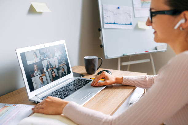 istock Woman using app for video call to several people 1285491094