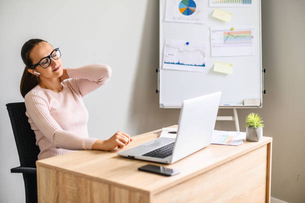 istock Tired from work young woman in office 1285491124