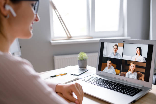 istock Woman using app for video call to several people 1285491150