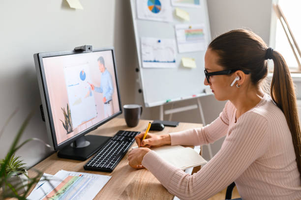 istock A woman in office is watching online classes 1285491158