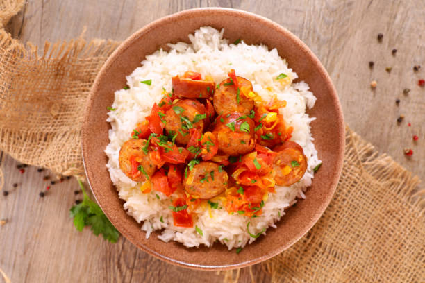 creole dish- rougail- sausage with spicy tomato sauce and rice creole dish- rougail- sausage with spicy tomato sauce and rice tomato rice stock pictures, royalty-free photos & images