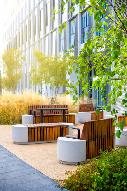 istock Small green square with benches in a modern urban space 1285492196