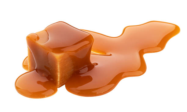 istock Caramel candy and caramel sauce isolated on white background 1285492439