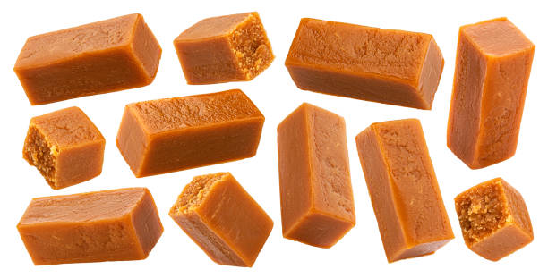istock Caramel candies isolated on white background 1285492472