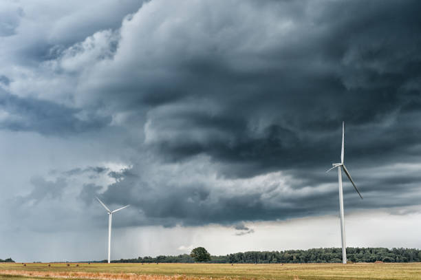 Windmill with Stormy Sky. Cloudy Sky Windmill with Stormy Sky. Cloudy Stormy Sky landscape alternative energy scenics farm stock pictures, royalty-free photos & images