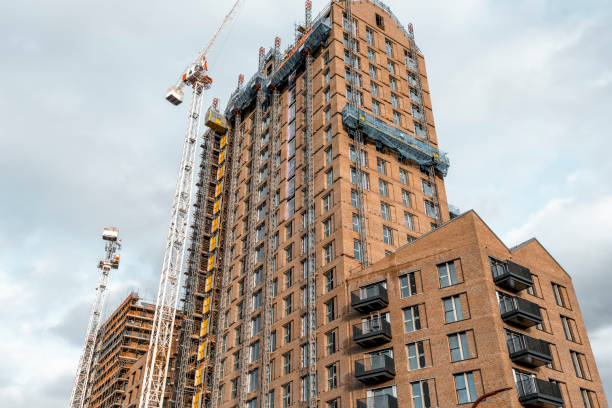 istock Tower crane at construction site of apartment buildings 1285493733