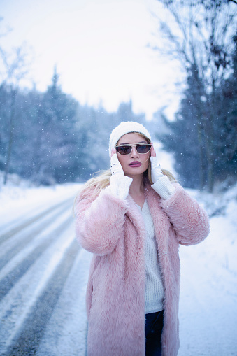 blonde beautiful girl in the snow
