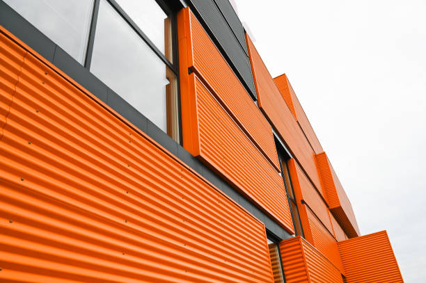 Orange metal building facade, bottom view Orange metal building facade, bottom view. High quality photo sandwich panel photos stock pictures, royalty-free photos & images