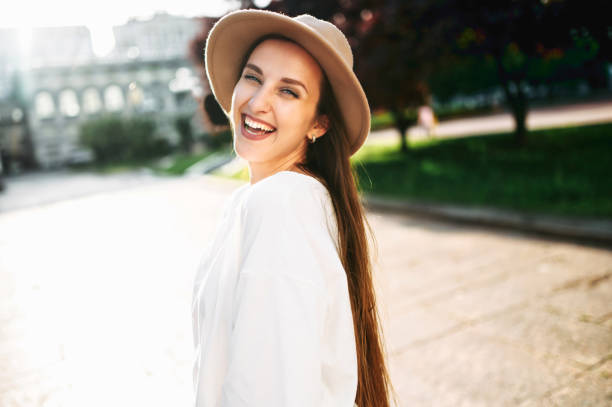 istock Charming woman in hat walks in the downtown 1285497666