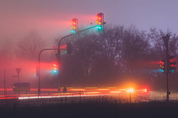 istock traffic lights in fog at night 1285498758