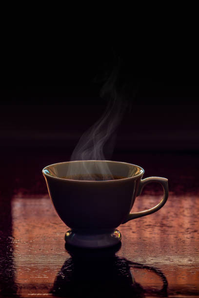 White cup with coffee.