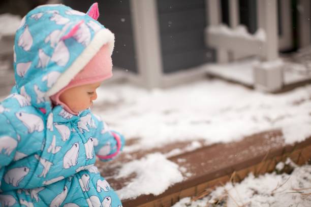 istock cute infant in the snow 1285499133