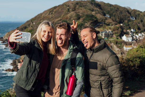 istock Three Friends Taking A Selfie by the Coast 1285500464