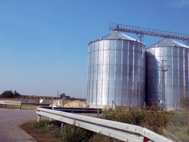 istock Metal grain silos by the roadside 1285502214