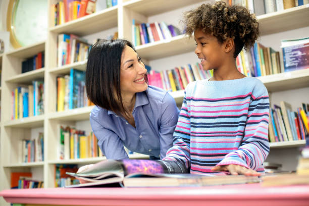 istock Girl and a librarian 1285507347