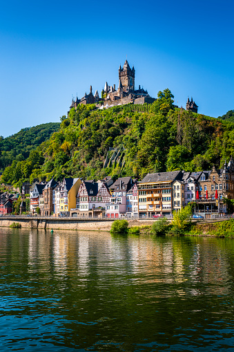 Cochem, Germany - August 07, 2020: Panoramic image of Cochem with old Reichsburg castle on a hill and  Mosel River