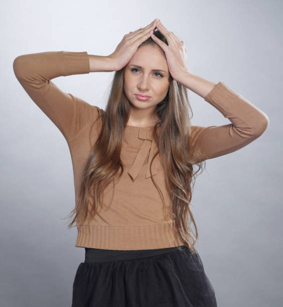istock Young girl with headache 1285508270
