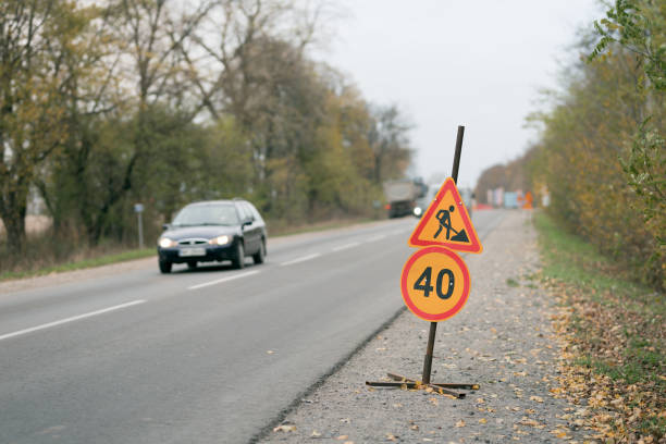 istock Road repairs, warning signs. Track laying concept 1285511066