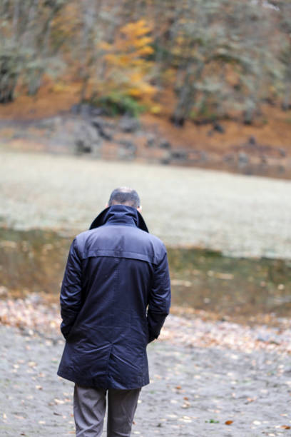 istock handsome man outdoors in fall clothing with autumn natural surroundings 1285512827