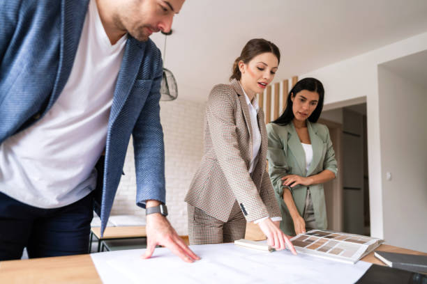 istock Young people making design and renovation plans 1285512939