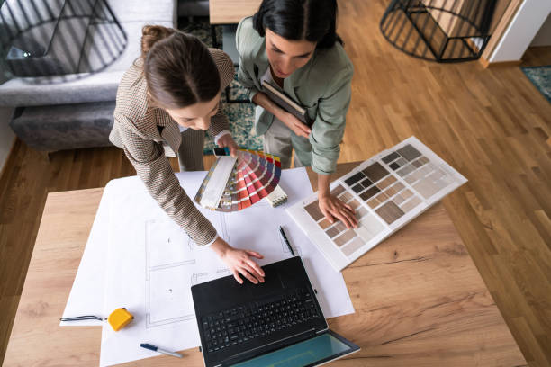 istock High angle view of a female designers working on interior ideas and using a laptop 1285513017