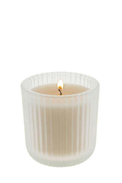 White candle in a clear glass container