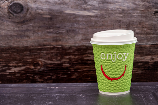 Green disposable coffee takeaway cup