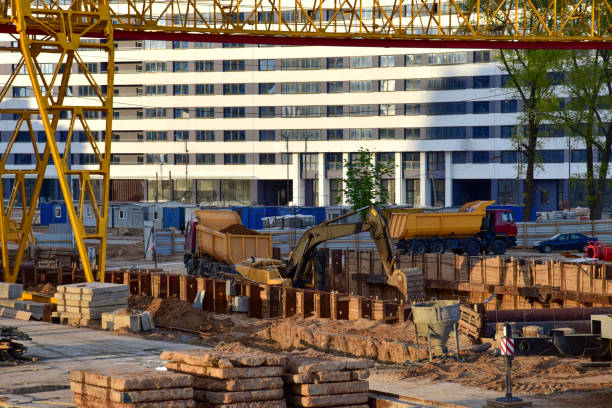 istock Excavator working at construction of a new metro line. Contractor digding the tunnel subway and railway station platform deep underground 1285514462