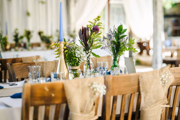 istock Table decoration for a special occasion -  boho wedding table set up. Outdoor wedding/party 1285514738