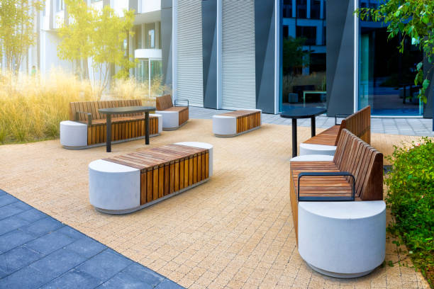 istock Small green square with benches in a modern urban space 1285515861