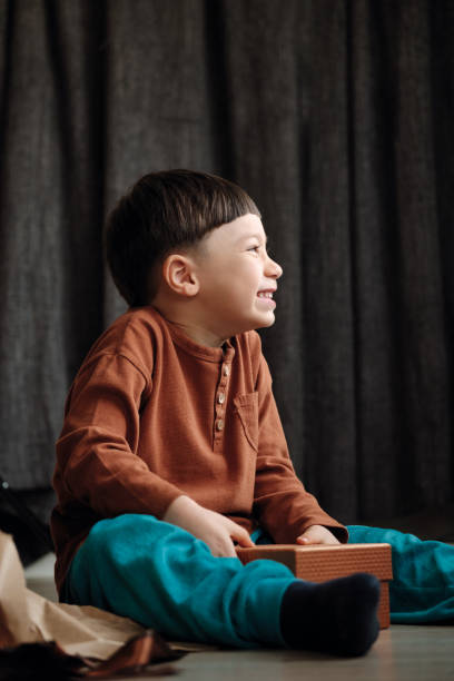 istock 4-5 years old child receiving a gift 1285517337