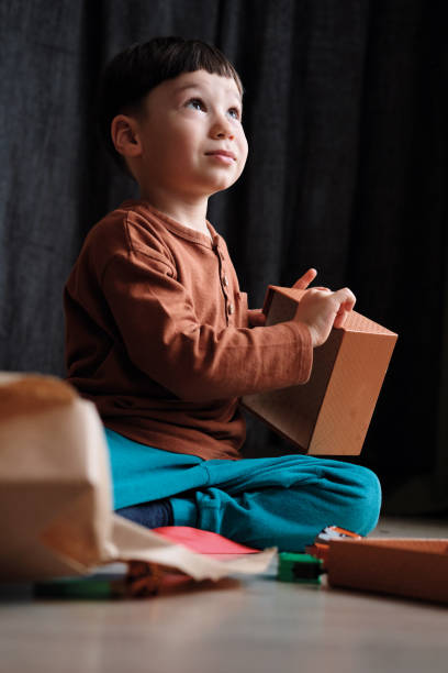 istock 4-5 years old child receiving a gift 1285517354