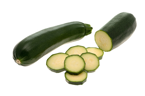 Fresh Zucchini with slices - white background