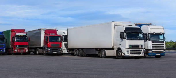 istock Group of large trucks on a highway 1285522342