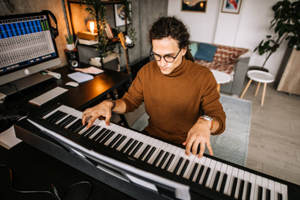 istock Young pianist practicing piano song in his home studio 1285524841