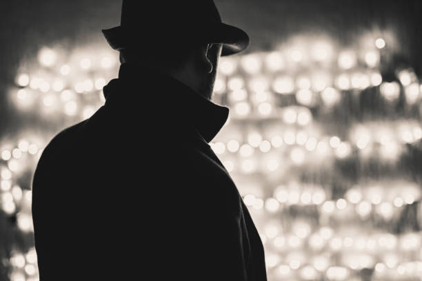 Retro man wears coat and hat Retro man wears coat and hat, black and white. Noir style. film noir style photos stock pictures, royalty-free photos & images