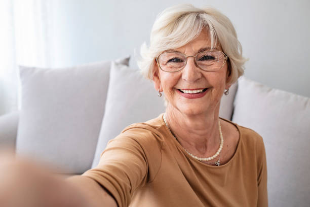 istock Charming Beautiful Elderly Lady Granny Grandma Taking a Selfie 1285526921