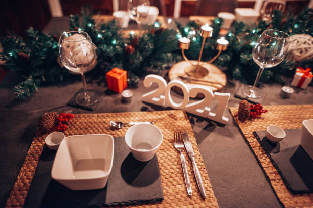 Beautiful table setting with crockery for a party, wedding reception or other festive event. Glassware and cutlery for catered event dinner.